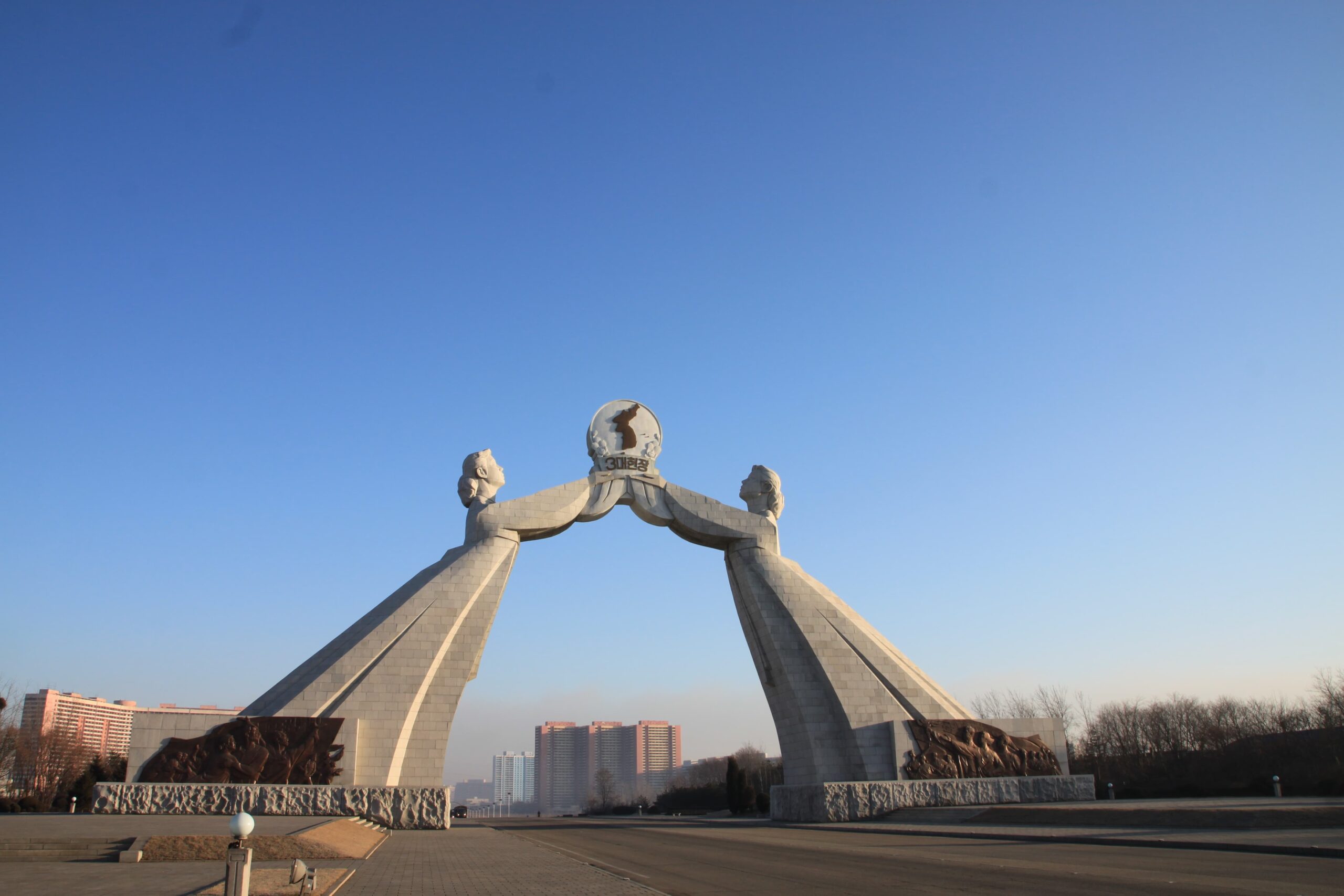 low-angle-view-statues-road-against-clear-blue-sky (1)