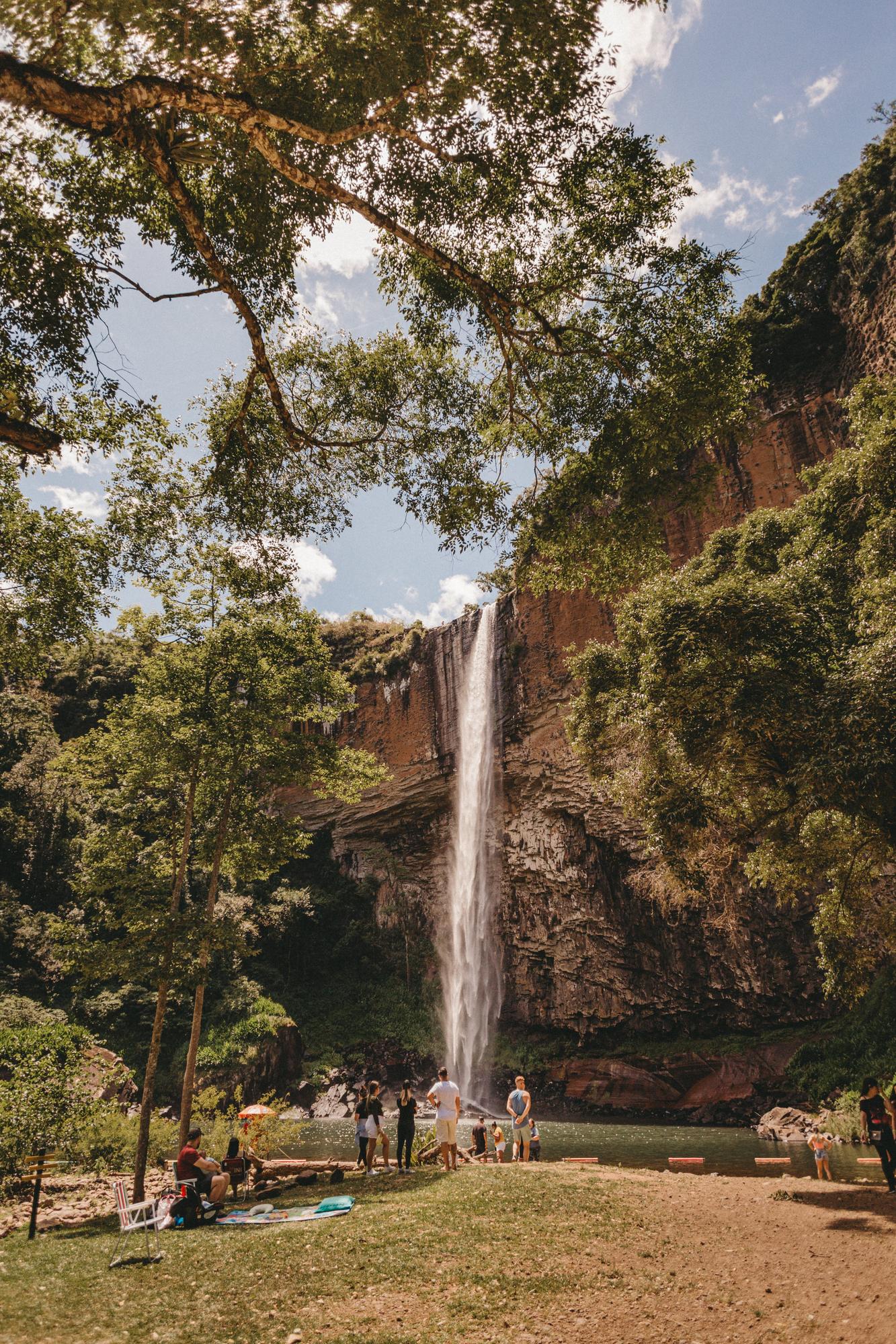 people-standing-near-waterfalls-cascading-from-mountain-photo (1)